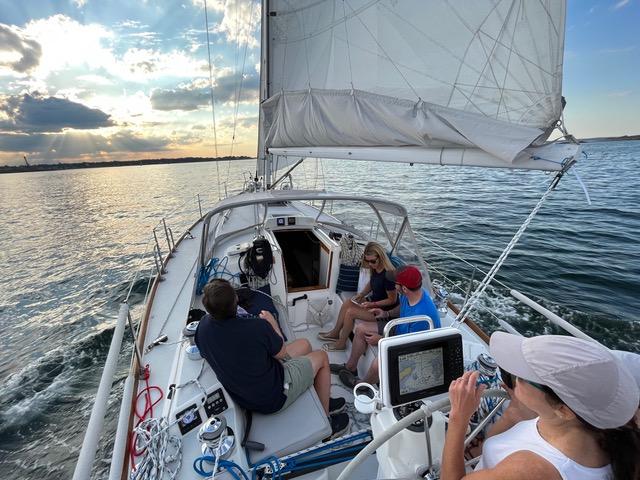 Leadership team navigating together at golden hour